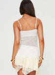 Longline crochet top Adjustable shoulder straps, v-neckline, tie fastening at bust, split hem