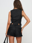 back view of model wearing Princess Polly Isibel Skort Black Low Rise Shorts 