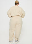 back view of model wearing Princess Polly Princess Polly Track Pants Block / Cursive Text Stone Curve High Waisted Pants 