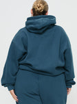 back view of model wearing Princess Polly Princess Polly Hooded Sweatshirt Block / Cursive Text Slate Curve 