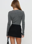 back view of model wearing Princess Polly Essentially Skort Black High Waisted Shorts 