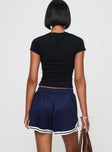 back view of model wearing Princess Polly Longer Days Short Navy High Waisted Shorts 