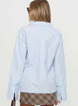 back view of model wearing Princess Polly Calistoga Deep Collar Shirt Blue Full Sleeves V-Neck 