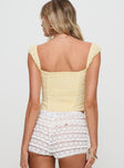 back view of model wearing Princess Polly Lyncher Top Yellow Short Sleeves Square Neck 