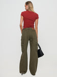 back view of model wearing Princess Polly Ahstin Cargo Jeans Green Petite Mid Rise 