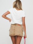 back view of model wearing Princess Polly Velveta Low Rise Denim Skirt Camel Mini Skirts 