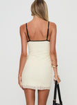 back view of model wearing Princess Polly Nolane Mini Dress Cream V-Neck 