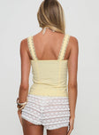 back view of model wearing Princess Polly Stellah Top Yellow Sleeveless Sweetheart 