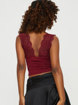 Front view of model wearing  front Princess Polly Sleeveless Square Neck  Typha Top Burgundy