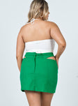 back view of model wearing Princess Polly Amara Cut Out Mini Skirt Green 