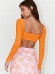 back view of model wearing Princess Polly Becca Long Sleeve Crop Top Orange 