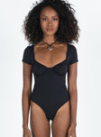 Front view of model wearing  front Princess Polly Short Sleeves Sweetheart  Mesha Bodysuit Black