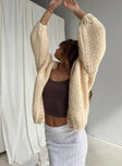 side view of model wearing Princess Polly Lester Knit Cardigan Cream Long 