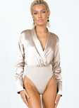 front view of model wearing Princess Polly Juliana Long Sleeve Bodysuit Champagne Full Sleeves V-Neck 