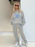 Front view of model wearing  front Princess Polly High Waisted Pants  Princess Polly Track Pants Cursive Text Grey / Blue