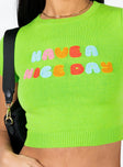 Front view of model wearing  front Princess Polly Full Sleeves High Neck  Have a Nice Day Knit Tee Green