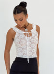 Front view of model wearing  front Princess Polly Sleeveless Crew Neck  Kaufman Lace Top White