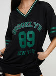 front view of model wearing Princess Polly Michail Jersey Mini Dress Green V-Neck 