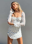 Front view of model wearing  front Princess Polly Square Neck  Dyer Sheer Sleeve Mini Dress White Floral