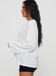 side view of model wearing Princess Polly Veracruz Long Sleeve Top White Full Sleeves Crew Neck 