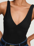 front view of model wearing Princess Polly Nellie Bodysuit Black Sleeveless Plunger 