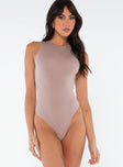 front view of model wearing Princess Polly Crespi Bodysuit Beige Sleeveless Crew Neck 