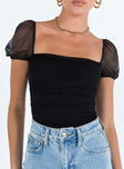 Front view of model wearing  front Princes Polly Short Sleeves  Dostan Bodysuit Black