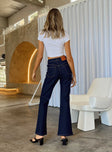 Front view of model wearing  front Princess Polly High Waisted  Johnny Flare Dark Wash Jeans Denim