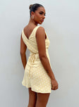 Front view of model wearing  front Princess Polly Sweetheart Neckline  Nellie Mini Dress Yellow Polka Dot