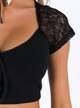 Front view of model wearing  front Princess Polly Short Sleeves Asymmetric Neckline  Elleny Top Black