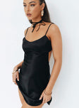 Front view of model wearing  front Princess Polly Asymmetric Neckline  Clemence Mini Dress Black