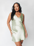 Front view of model wearing  front Princess Polly Asymmetric Neckline  Norma Mini Dress Green