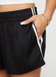 side view of model wearing Princess Polly 444 Shorts Black High Waisted Shorts 