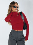 Front view of model wearing  front Princess Polly Full Sleeves High Neck  Elysium Long Sleeve Turtleneck Top Red