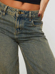 back view of model wearing Princess Polly Tap In Mid Rise Jeans Tea Wash Mid Rise 