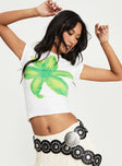 side view of model wearing Princess Polly Tiona Summer Flower Top White / Lime Short Sleeves Crew Neck 