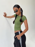 Front view of model wearing  front Princess Polly Short Sleeves High Neck  Rosalinda Top Olive