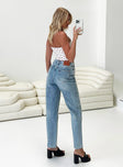 Front view of model wearing  front Princess Polly High Waisted  Holly Asymmetric Straight Leg Jean Light Wash Tall