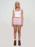 side view of model wearing Princess Polly Orielle Low Rise Boxer Short Pink High Waisted Shorts 