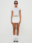 side view of model wearing Princess Polly Emberia Skort White High Waisted Shorts 