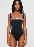 Front view of model wearing  front Princess Polly Sleeveless Square Neck  Keating Bodysuit Black