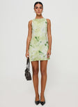 side view of model wearing Princess Polly Vivre Mini Dress Green Floral Crew Neck 