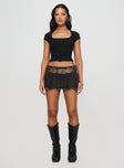 side view of model wearing Princess Polly Baseline Square Neck Rib Top Black Short Sleeves Square Neck 