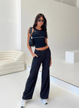 side view of model wearing Princess Polly Archie Low Rise Pants Black Tall Mid Rise 