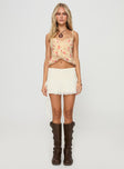 front view of model wearing Princess Polly Niklaus Top Cream Floral Sleeveless V-Neck 