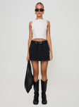 side view of model wearing Princess Polly Gazelle Denim Skort Washed Black High Waisted Shorts 