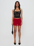 front view of model wearing Princess Polly Gigi Lace Skort Red High Waisted Shorts 