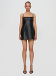 front view of model wearing Princess Polly Isak Woven Faux Leather Mini Dress Black Square Neck 