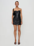 side view of model wearing Princess Polly Hotline Faux Leather Mini Dress Black Sweetheart Neckline 