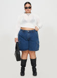 front view of model wearing Princess Polly Mika Carpenter Denim Shorts Mid Wash Curve 